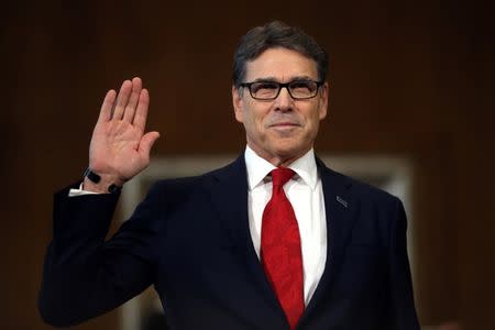 Former Texas Governor Rick Perry is sworn in before testifying at a Senate Energy and Natural Resources Committee hearing on his nomination to be Energy secretary on Capitol Hill in Washington, U.S., January 19, 2017. REUTERS/Carlos Barria