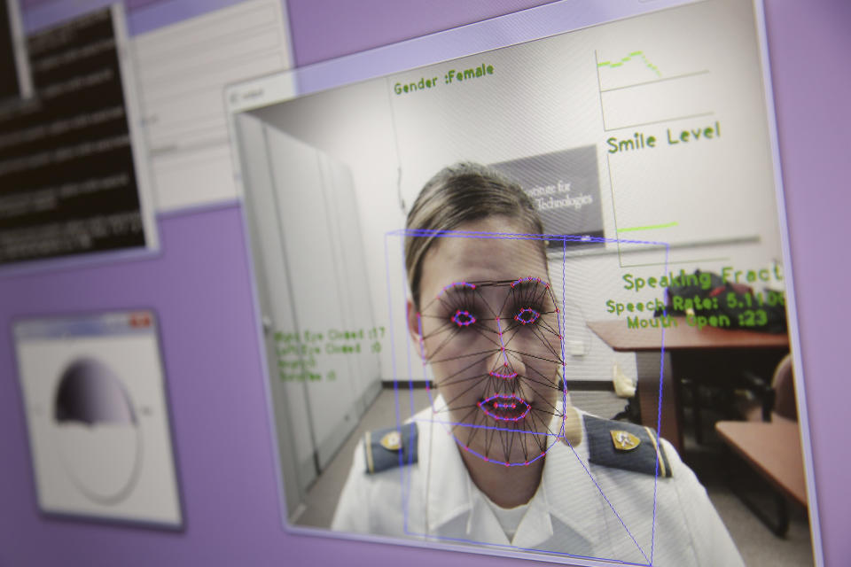 In this file photo from May 2, 2019, a computer monitors some of Cadet Cheyenne Quilter's reactions as she works with a virtual reality character named "Ellie" at the U.S. Military Academy at West Point, N.Y. Artificial intelligence is spreading into health care, often as software or a computer program capable of learning from large amounts of data and making predictions to guide care or help patients. (AP Photo/Seth Wenig, File)