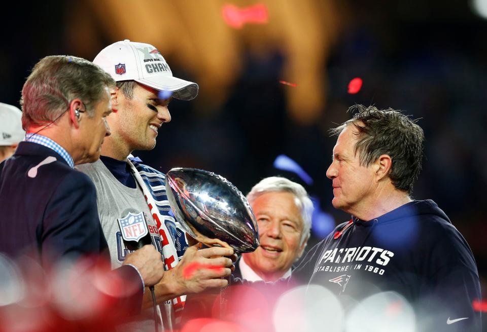 GLENDALE, AZ - FEBRUARY 01:   Tom Brady #12, team owner Robert Kraft, and head coach Bill Belichick of the New England Patriots celebrate with the Vince Lombardi Trophy after defeating the Seattle Seahawks 28-24 to win Super Bowl XLIX at University of Phoenix Stadium on February 1, 2015 in Glendale, Arizona.  (Photo by Tom Pennington/Getty Images)