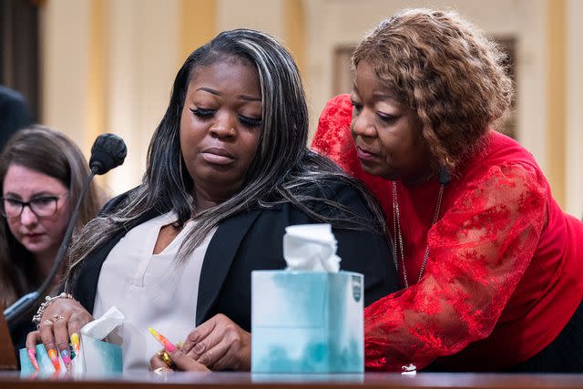 Tom Williams/CQ-Roll Call, Inc via Getty Fulton County election worker Shaye Moss is comforted by her mother Ruby Freeman as she tells House members about the death threats her family received after being accused of rigging the 2020 election