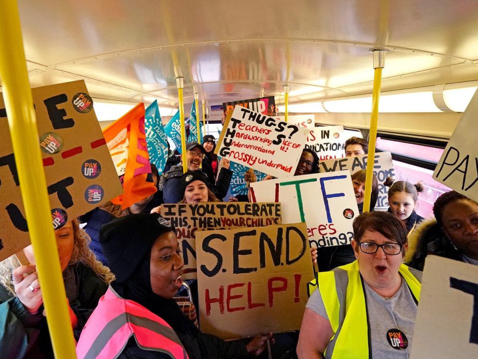 Striking teachers from the National Education Union on board a routemaster bus travelling into central London (PA)