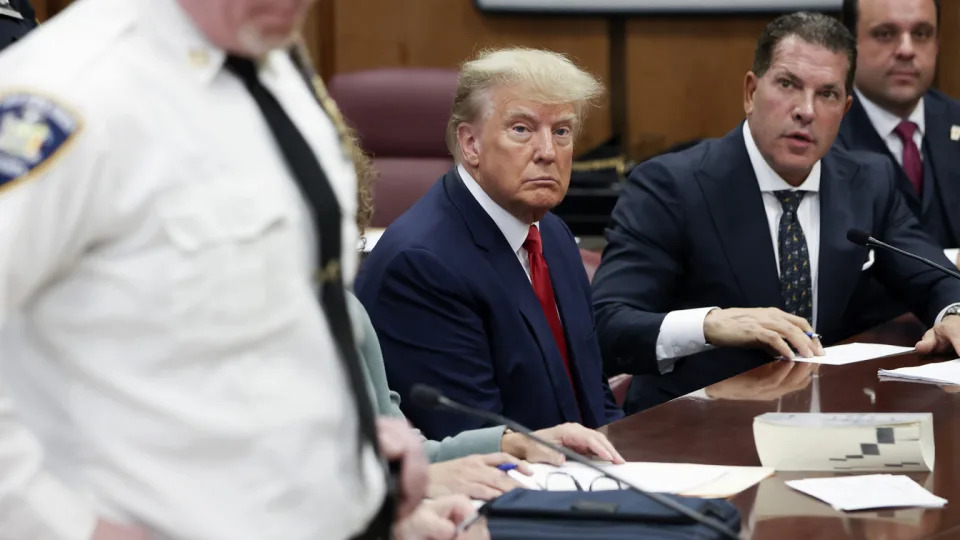 Former President Donald Trump sits in the courtroom with his attorneys Joe Tacopina and Boris Epshteyn.