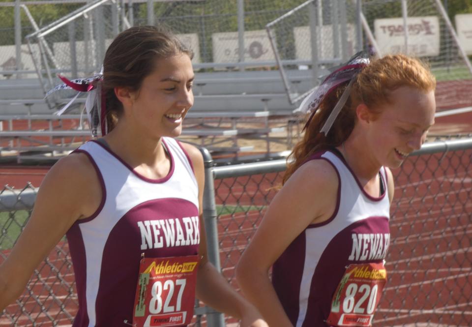 Newark's Gwen Stare and Allison Dietz talk following the Ohio Capital Conference-Buckeye Division race, which was won by the Wildcats in October. Stare is The Advocate Female Athlete of the Year.