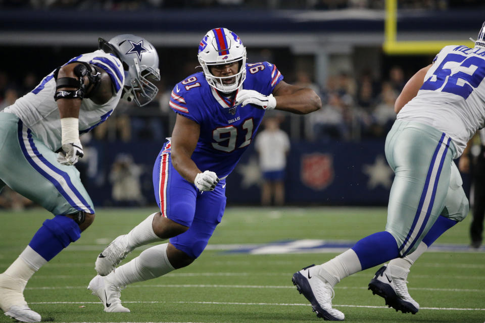 File-This Nov. 28, 2019, file photo shows Dallas Cowboys' Tyron Smith, left, and Buffalo Bills defensive tackle Ed Oliver (91) facing off during an NFL football game in Arlington, Texas. Oliver was arrested Saturday, May 16, 2020, by police in the Houston area and charged with drunk driving and illegally carrying a gun. Montgomery County sheriff’s deputies pulled Oliver over after receiving reports around 9 p.m. of someone driving recklessly in a construction area north of the city, local media outlets reported, citing jail and police records and statements from sheriff's officials. (AP Photo/Michael Ainsworth, File)