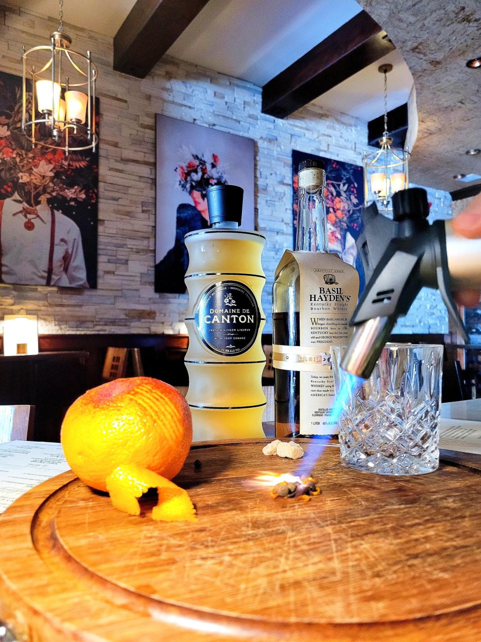 The Ginger Old Fashioned at The Raconteur in Pleasantville is made by torching a cube of turbinado sugar with clove, allspice and orange zest, creating a little smoke on the inside of the glass, before muddling the smoked sugar with orange bitters.