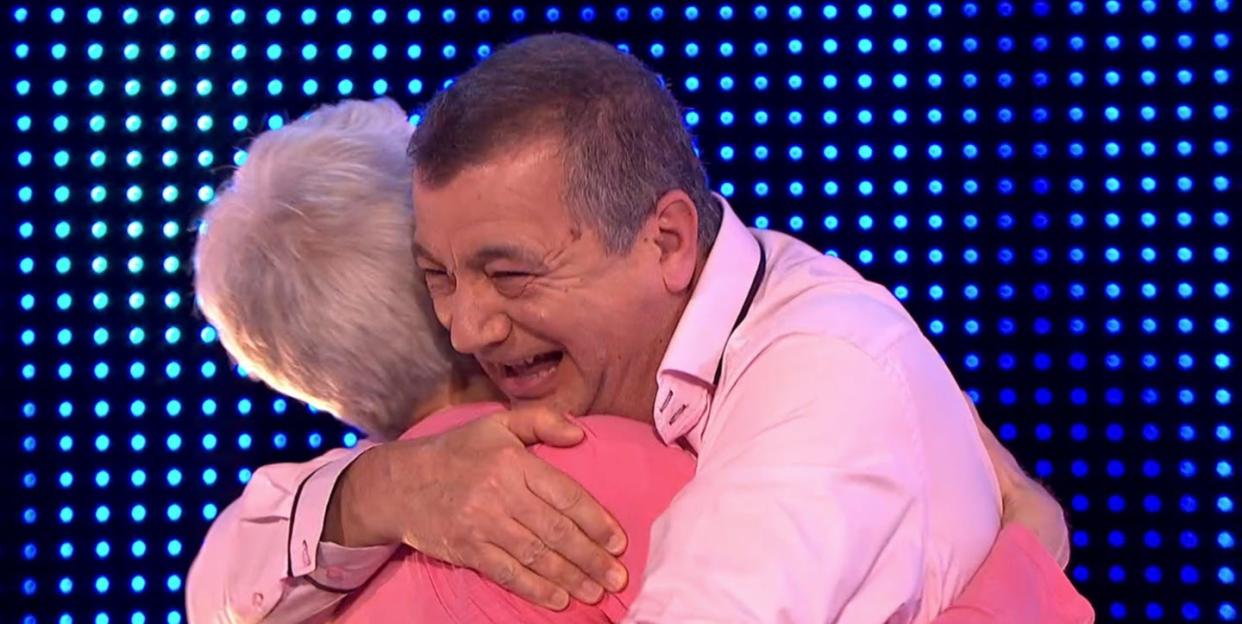 karen, ian hug after winning on the chase