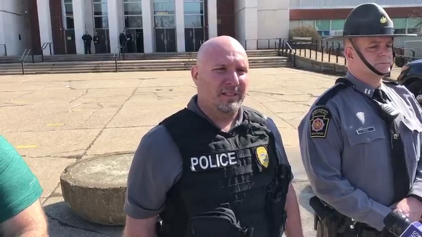 This is a frame grab from video of Inspector Mike Nolan, center, of the Erie Bureau of Police, provides an update to a shooting that injured one person at Erie High School.