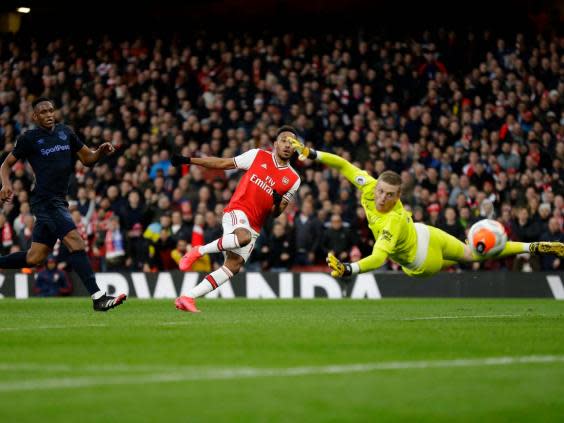 Pierre-Emerick Aubameyang curls in Arsenal's opening goal (AP)