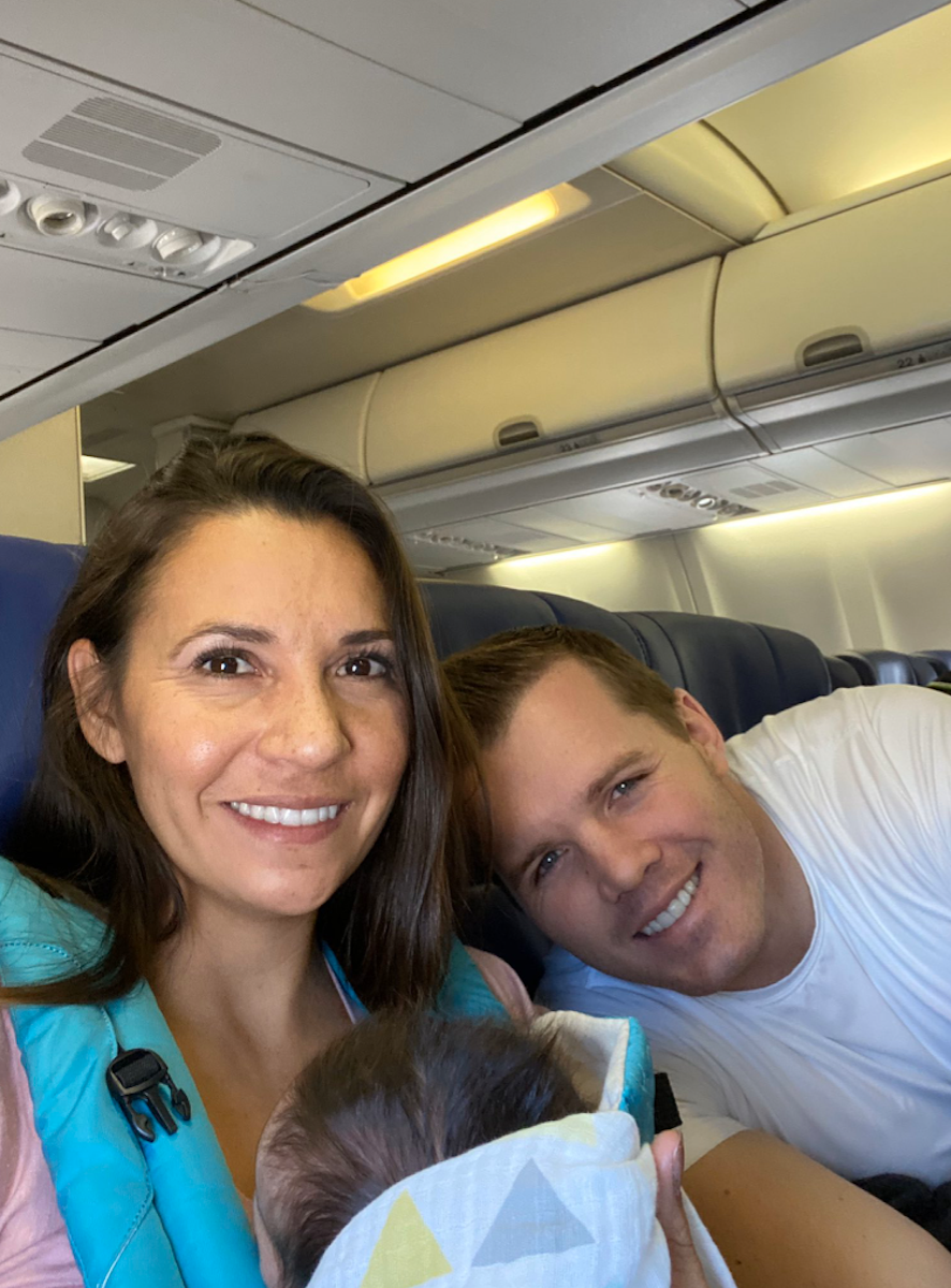 The Moores flying home with their baby girl. (Photo: Dustin Moore)