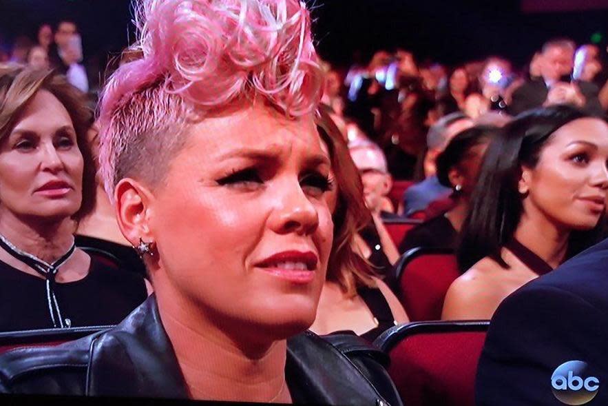 Awkward: Pink watching Christina Aguilera at the AMAs