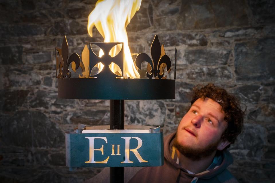 Lewis Wilde tests one of the gas-fuelled beacons he has made which will be used to signal the start of Queen Elizabeth II’s Platinum Jubilee in June (Jane Barlow/PA) (PA Wire)