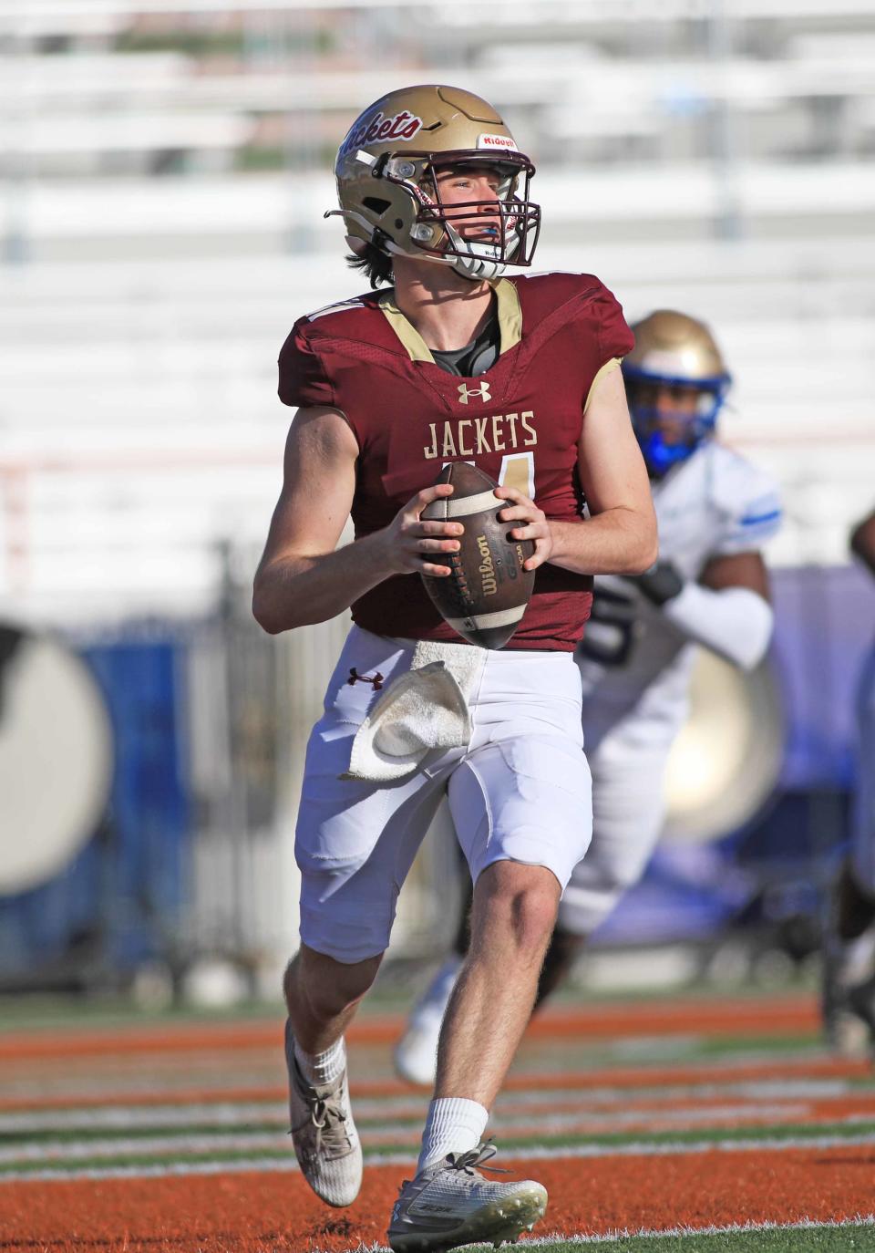 St. Augustine quarterback Locklan Hewlett looks for a target down field during the Class 3S state championship game in Tallahassee on Thursday.