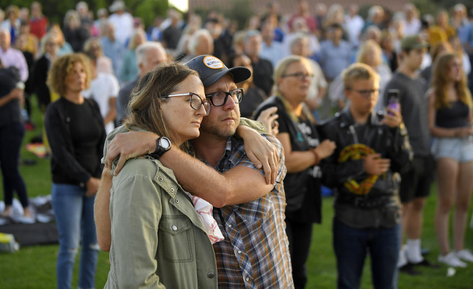 Attendees hug during a vigil Friday, Sept. 6, 2019, in Santa Barbara, Calif., for the victims who died aboard the dive boat Conception. The Sept. 2 fire took the lives of 34 people on the ship off Santa Cruz Island off the Southern California coast near Santa Barbara. (AP Photo/Mark J. Terrill)