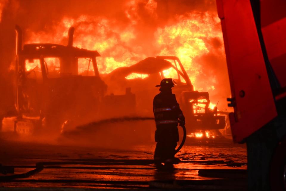 Firefighters battled a blaze that broke out Saturday night at North Atlantic Fuels, where three fuel oil tanker trucks were on fire.