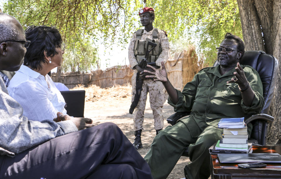 In this photo taken Tuesday, April 29, 2014 and released by the United Nations Mission in South Sudan (UNMISS) on Wednesday, April 30, 2014, United Nations High Commissioner for Human Rights Navi Pillay, 2nd left, accompanied by Special Adviser on the Prevention of Genocide Adama Dieng, left, meets with South Sudan's former Vice President and now rebel leader Riek Machar, right, at an undisclosed location in South Sudan. The U.N.'s top official for human rights told a news conference in South Sudan's capital Juba on Wednesday that the country is on the verge of catastrophe because of a deadly mix of recrimination, hate speech and revenge killings since December and that she is appalled by the apparent lack of concern by leaders in South Sudan over the risk of a potential famine. (AP Photo/UNMISS)