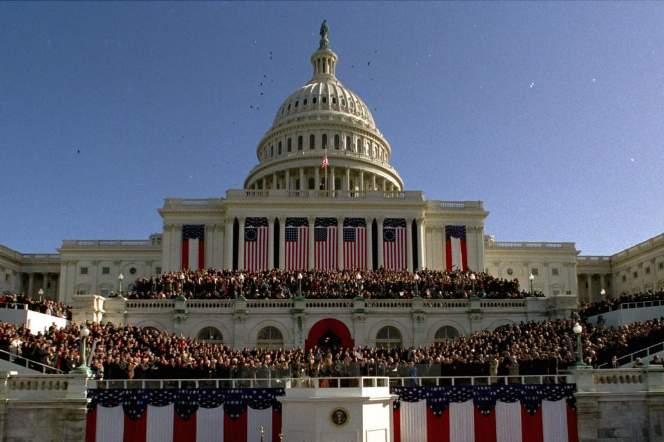 Thousands gather on Capitol Hill on Jan. 20, 1993, as President Clinton takes the oath of office as the 42nd president of the United States. (AP Photo/Ron Edmonds)