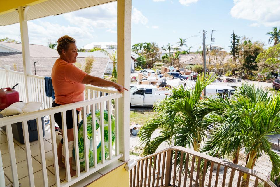 Oct 5, 2022; Fort Myers, FL, USA; Olivia Johnson explains how she was able to shelter several of her neighbors as rising waters flooded her neighborhood when Hurricane Ian hit the area as a Category 4 storm.. Mandatory Credit: Josh Morgan-USA TODAY