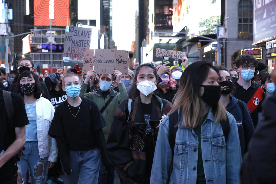 NEW YORK, UNITED STATES - 2020/10/02: Protesters wearing face masks gather in Times Square as they take part during the demonstration. Demonstrators gather in Times Square to demonstrate against the shooting of Roxanne Moore, a transgender woman. According to the Pennsylvania police, Moore a mentally ill woman, was shot 16 times while brandishing a gun in public. (Photo by John Lamparski/SOPA Images/LightRocket via Getty Images)
