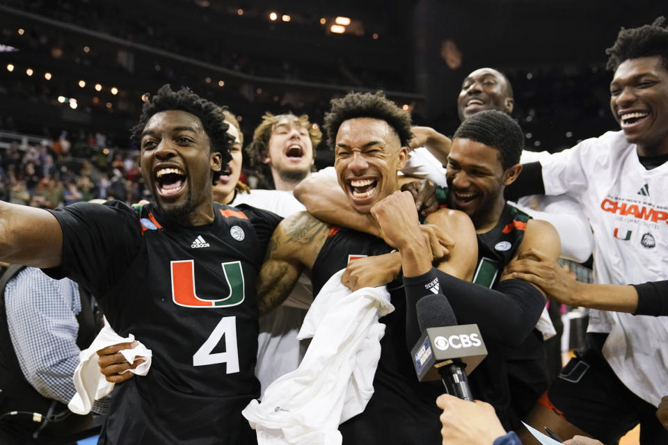 Miami celebrates after their win against Texas in an Elite 8 college basketball game in the Midwest Regional of the NCAA Tournament Sunday, March 26, 2023, in Kansas City, Mo (AP Photo/Jeff Roberson)