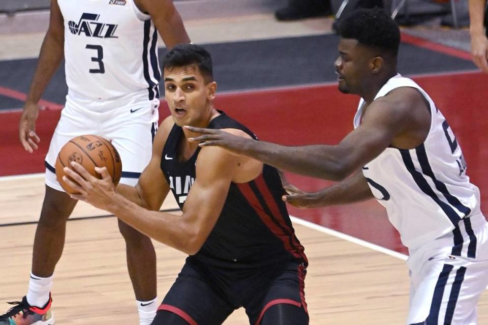 Miami Heat center Omer Yurtseven is defended by Utah Jazz center Udoka Azubuike during the first half of an NBA summer league basketball game Friday, Aug. 13, 2021, in Las Vegas.