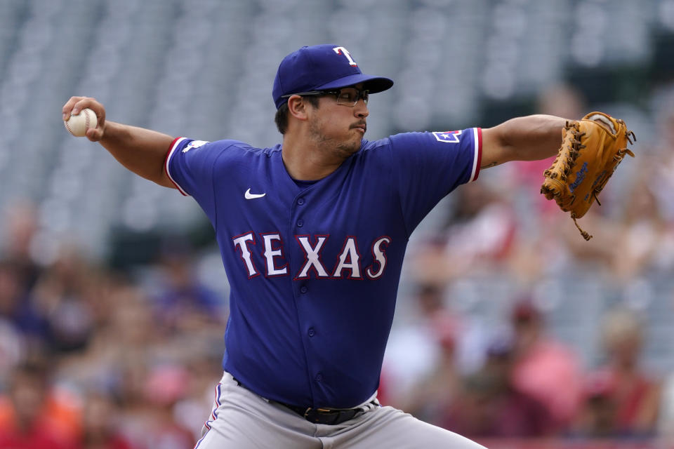 Texas Rangers starting pitcher Dane Dunning throws to the plate during the first inning of a baseball game against the Los Angeles Angels Sunday, July 31, 2022, in Anaheim, Calif. (AP Photo/Mark J. Terrill)