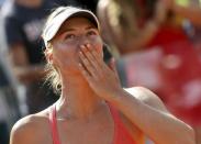 Maria Sharapova of Russia celebrates winning against Carla Suarez Navarro of Spain after their final match at the Rome Open tennis tournament in Rome, Italy, May 17, 2015. REUTERS/Stefano Rellandini