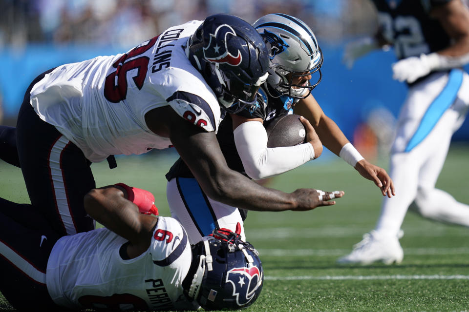 Houston Texans defensive tackle Maliek Collins (96) sacks Carolina Panthers quarterback Bryce Young (9) during the second half of an NFL football game, Sunday, Oct. 29, 2023, in Charlotte, N.C. (AP Photo/Erik Verduzco)