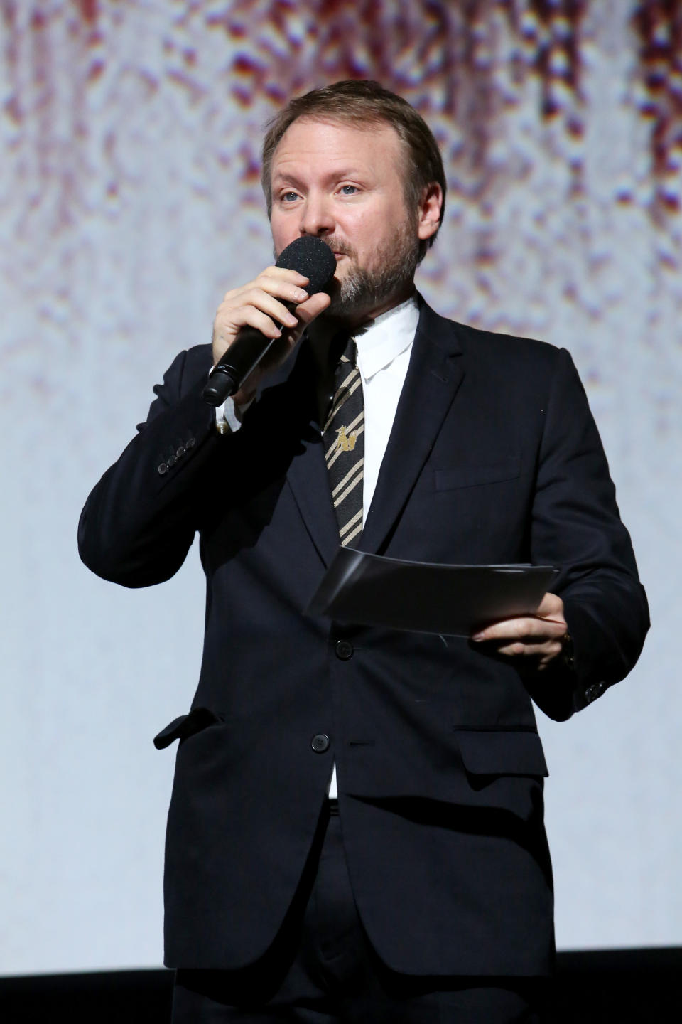 Writer-director Rian Johnson introduces the film. (Photo: Jesse Grant/Getty Images for Disney)