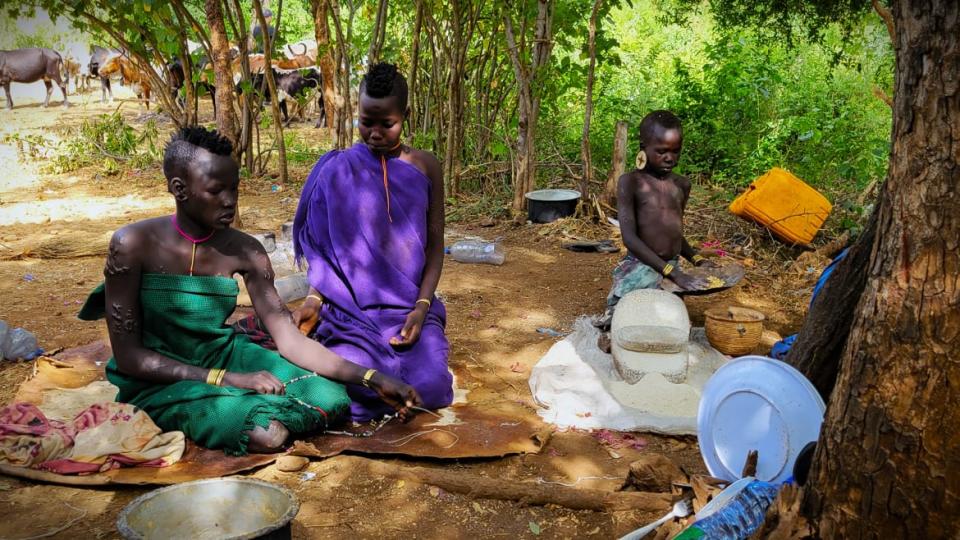 <div class="inline-image__caption"><p>Mursi girls making beads and chatting in their natural home.</p></div> <div class="inline-image__credit">Jody Ray</div>