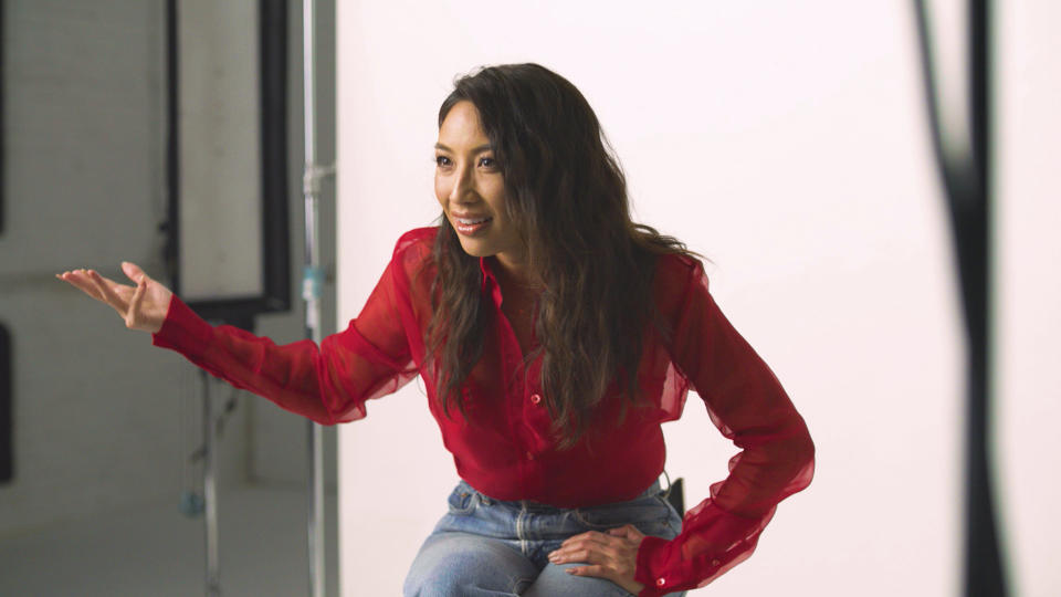 In this Nov. 22, 2019, photo provided by Ajinomoto, Jeannie Mai, co-host of TV's "The Real," is seen in New York filming a video for a campaign challenging Merriam-Webster's dictionary entry of "Chinese restaurant syndrome." Eddie Huang, a New York City-based chef and author (his memoir inspired the ABC sitcom “Fresh Off the Boat”), and TV's “The Real” co-host Mai are launching a social media effort Tuesday with Ajinomoto, the longtime Japanese producer of MSG seasonings. They plan to use the hashtag #RedefineCRS to challenge Merriam-Webster to rewrite the definition. (Courtesy of Ajinomoto via AP)