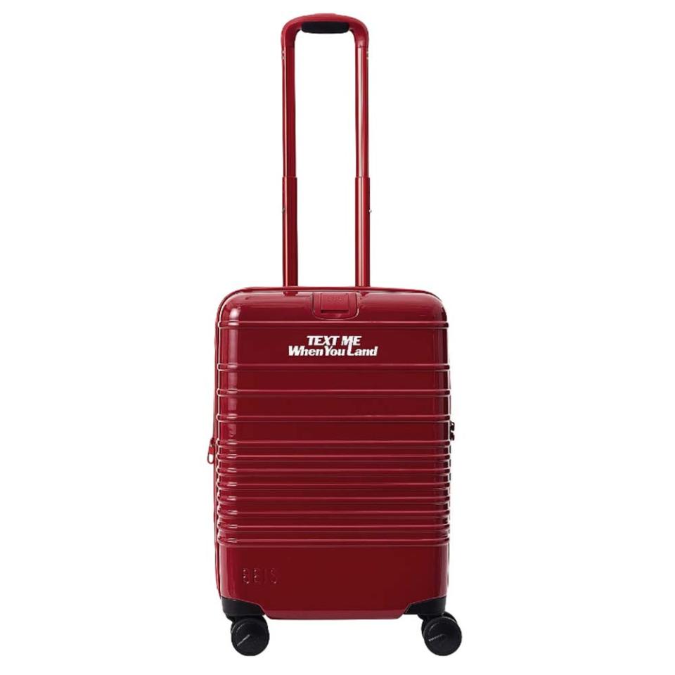 red carry-on suitcase