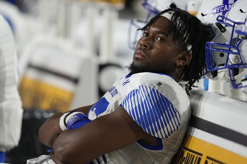 Indiana State running back Justin Dinka sits on the sideline during the second half of an NCAA college football game against Indiana, Friday, Sept. 8, 2023, in Bloomington, Ind. (AP Photo/Darron Cummings)