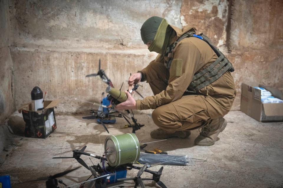 A Ukrainian soldier of the 71st Jaeger Brigade prepares FPV drones at the frontline near Avdiivka in the Donetsk region on March 22, 2024.