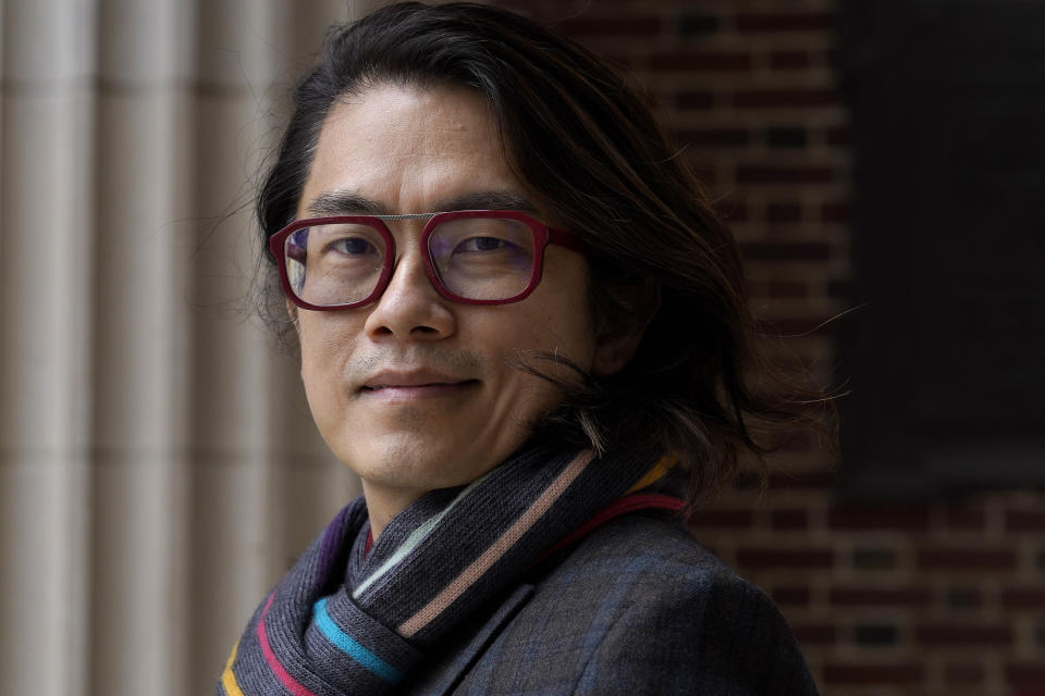 Eng-Beng Lim, a professor at Dartmouth College, stands for a photograph on the school's campus, Tuesday, April 20, 2021, in Hanover, N.H. A wave of anti-Asian attacks that started more than a year ago with the pandemic, along with the March 2021 shootings in Atlanta that left six Asian women dead, have provoked national conversations about the visibility of Asian Americans. (AP Photo/Steven Senne)