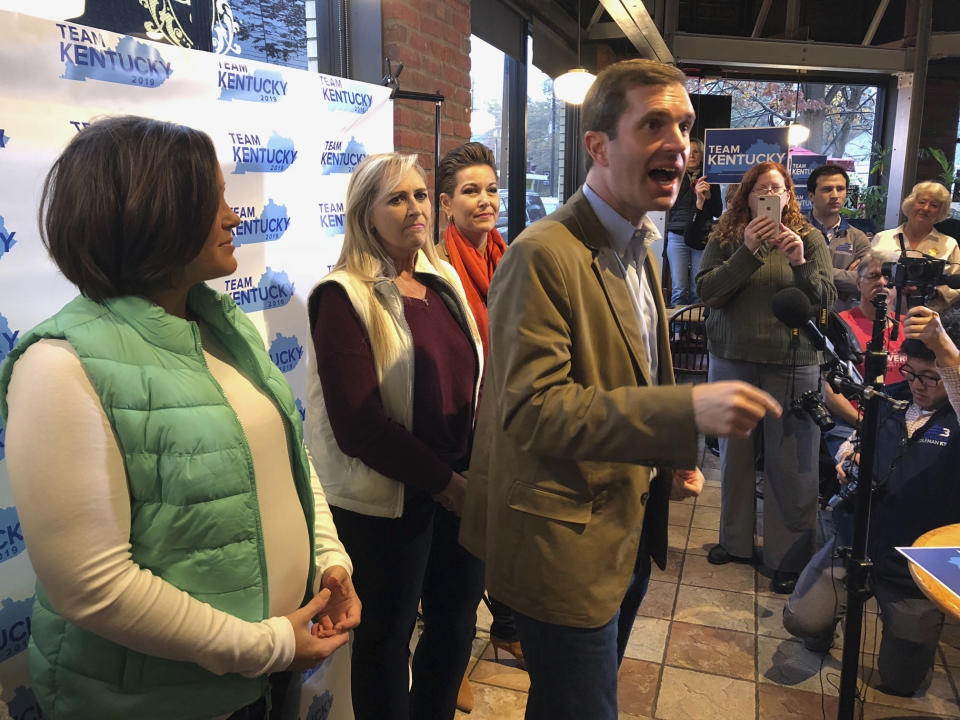 Democratic gubernatorial candidate Andy Beshear mingles with the crowd at a Louisville, Ky., coffeehouse, where he started his statewide bus tour on Wednesday, Oct. 30, 2019. Beshear, the state’s attorney general, is challenging Republican Gov. Matt Bevin in next Tuesday’s election in Kentucky. (AP Photo/Bruce Schreiner)
