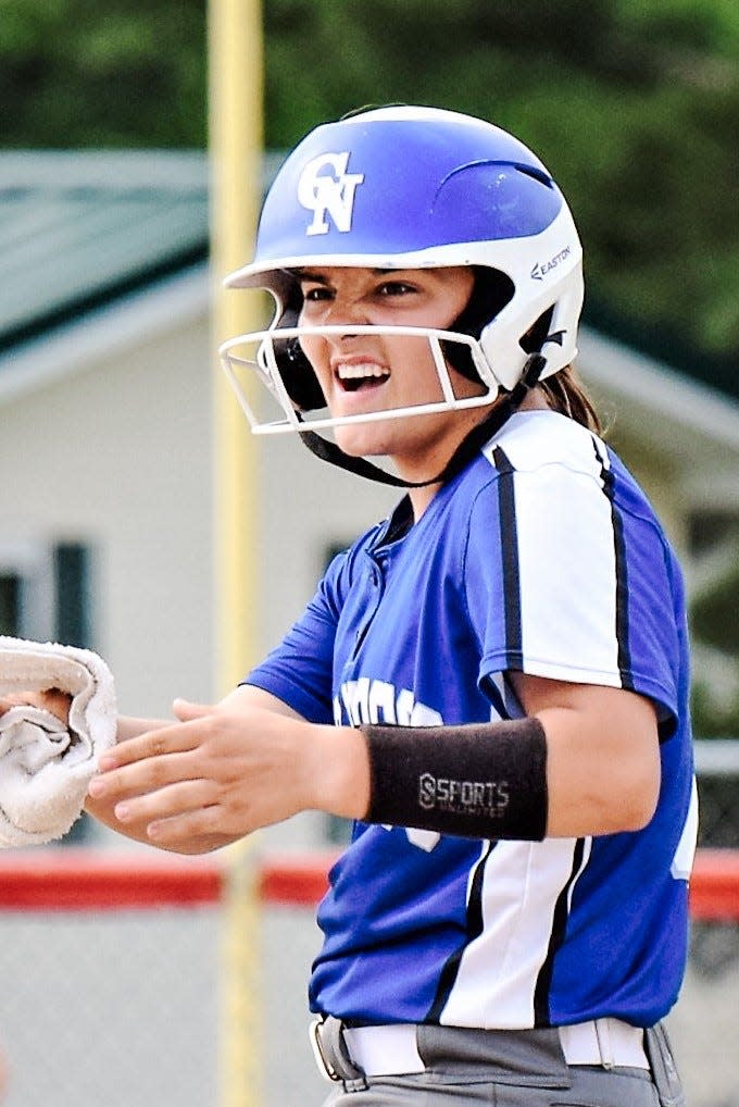 Colo-NESCO's Callie Kohlwes reacts to an RBI double during the Royal softball team's 16-4 victory at Dunkerton June 15.