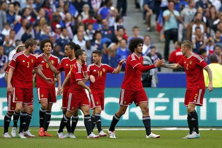 Belgium's Marouane Fellaini (2nd R) celebrates after scoring a goal during their international friendly soccer match against France at the Stade de France stadium in Saint-Denis, near Paris, France June 7, 2015. REUTERS/Benoit Tessier