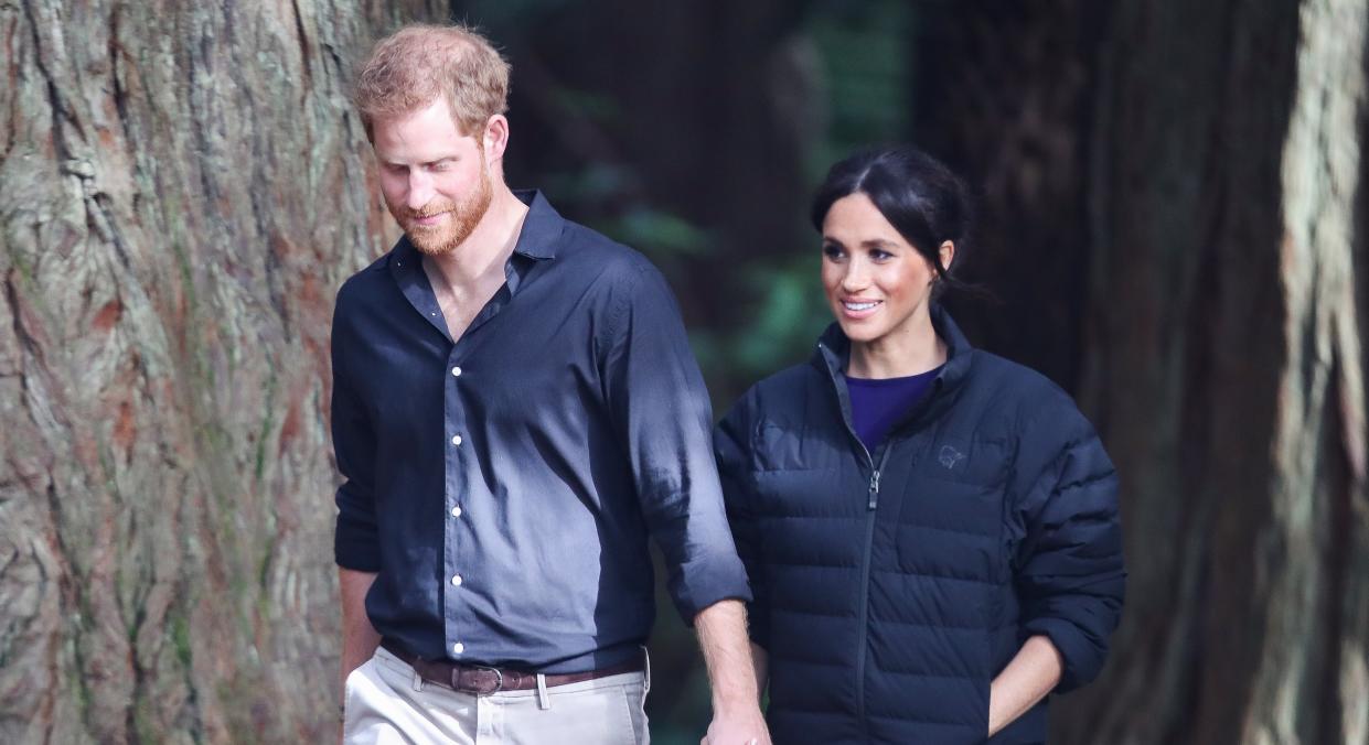 Meghan Markle paused her New Year's Day hike with Prince Harry to take a photo of a couple struggling with a selfie stick [Image: Getty]