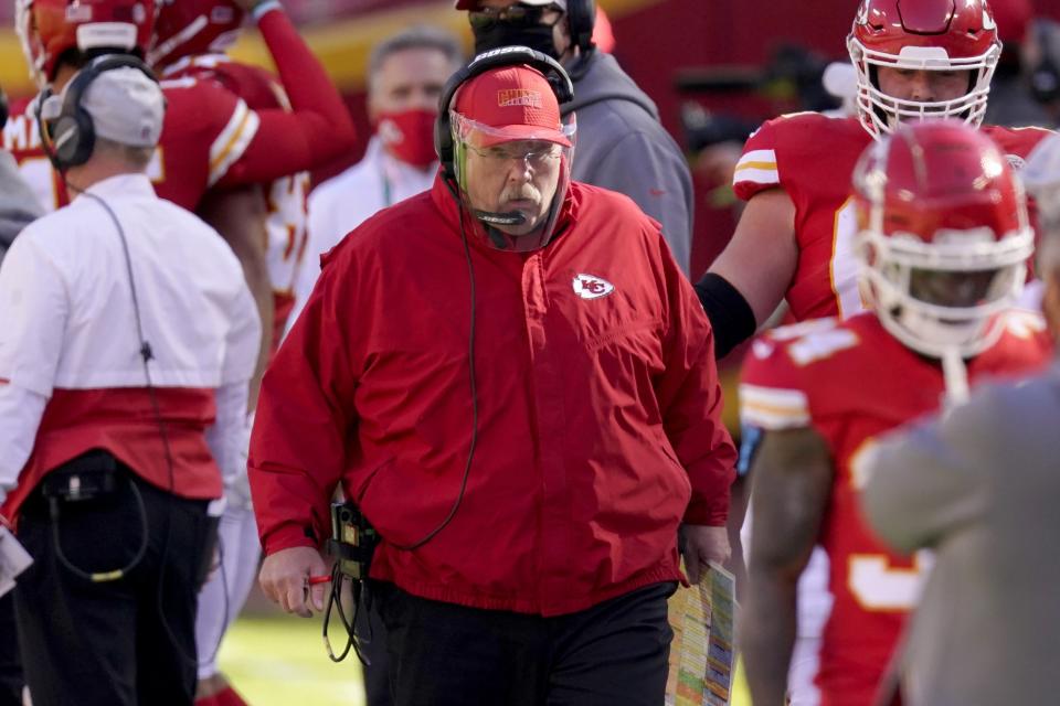 Kansas City Chiefs head coach Andy Reid, center, walks along the sideline in the first half of an NFL football game against the New York Jets on Sunday, Nov. 1, 2020, in Kansas City, Mo. (AP Photo/Charlie Riedel)