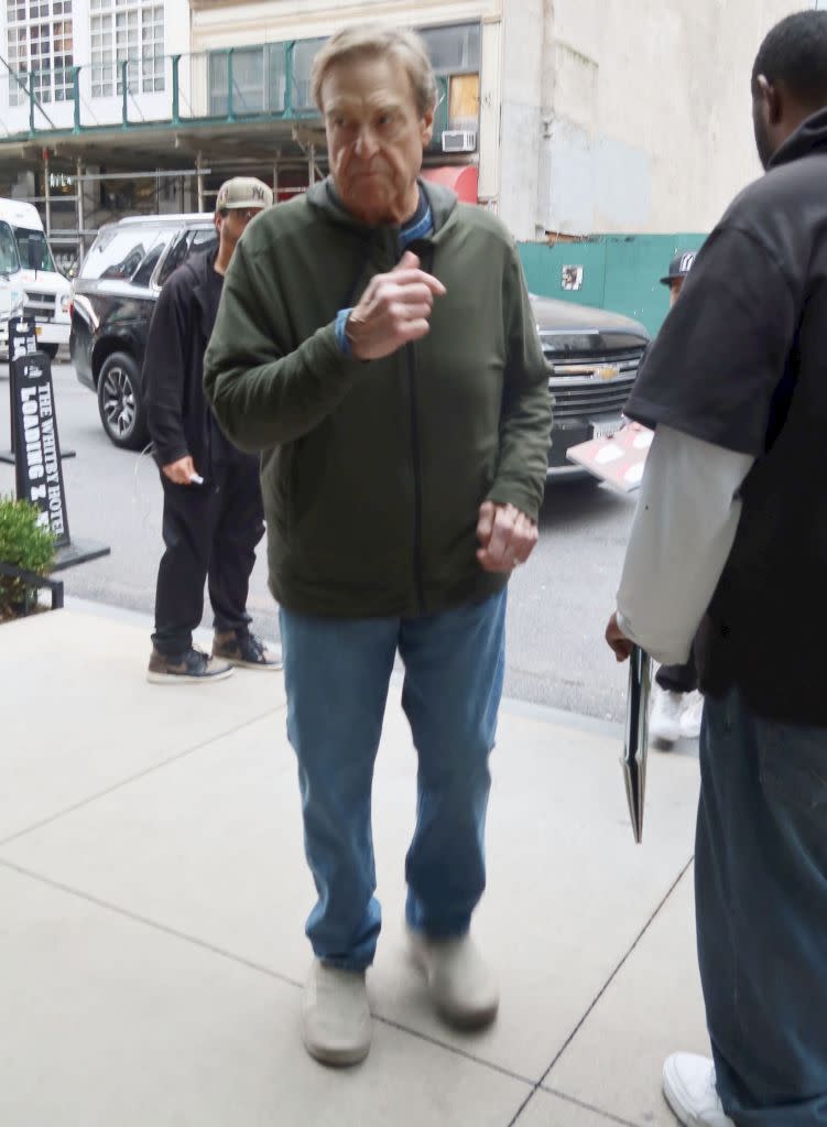 John Goodman stops for fans and signs autographs in Midtown. Rick Davis / SplashNews.com