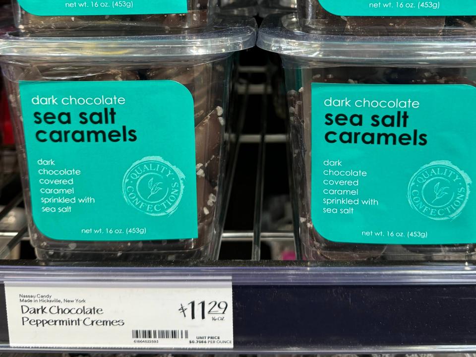 Clear packages of sea-salt caramels with teal labels and a price tag that reads "dark chocolate peppermint cremes $11.29"