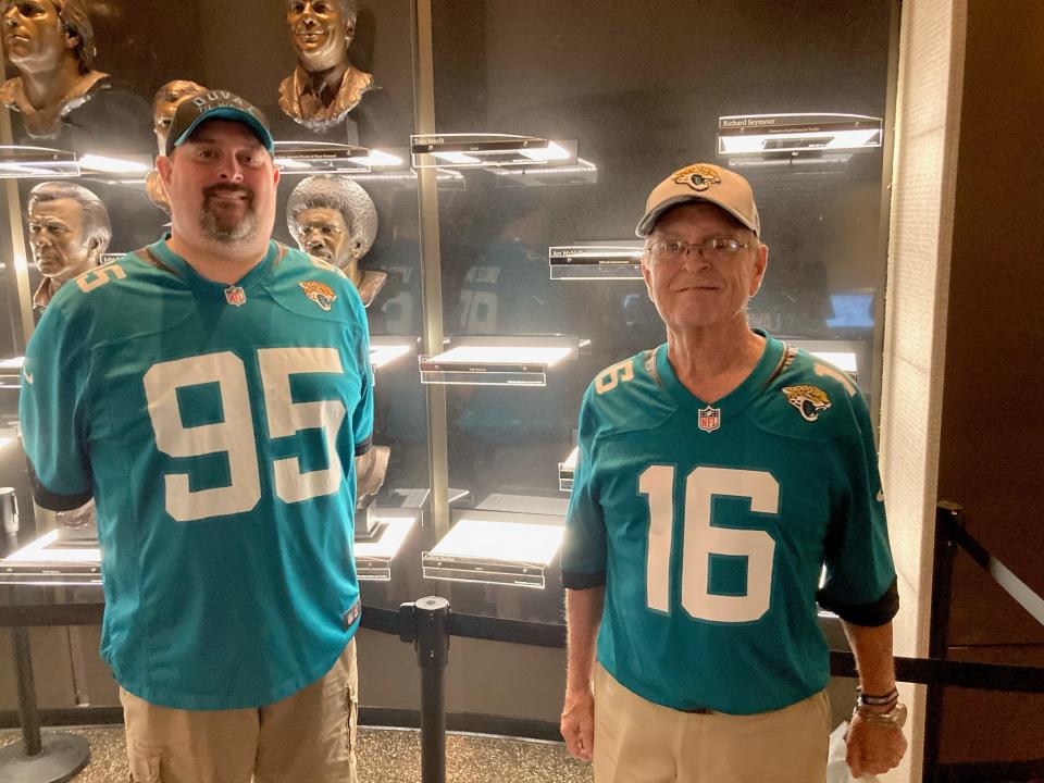 Ian Lotts (95), a Jaguars fan living in Indianapolis, stands with father Rick in front of the shelf reserved for the Tony Boselli bust at the Pro Football Hall of Fame the day before his enshrinement in Canton, Ohio.