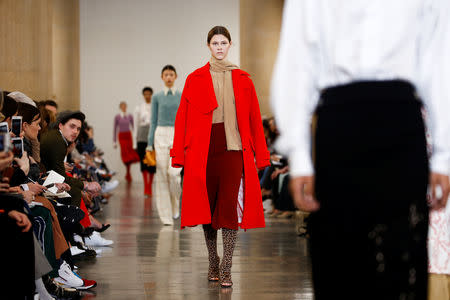 Models present creations at the Victoria Beckham show during London Fashion Week Women's A/W19 in London, Britain February 17, 2019. REUTERS/Henry Nicholls