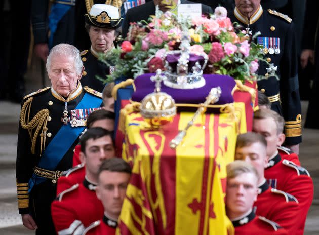 King Charles III follows the coffin of Queen Elizabeth II as it is carried out of Westminster Abbey after her State Funeral on September 19, 2022. 