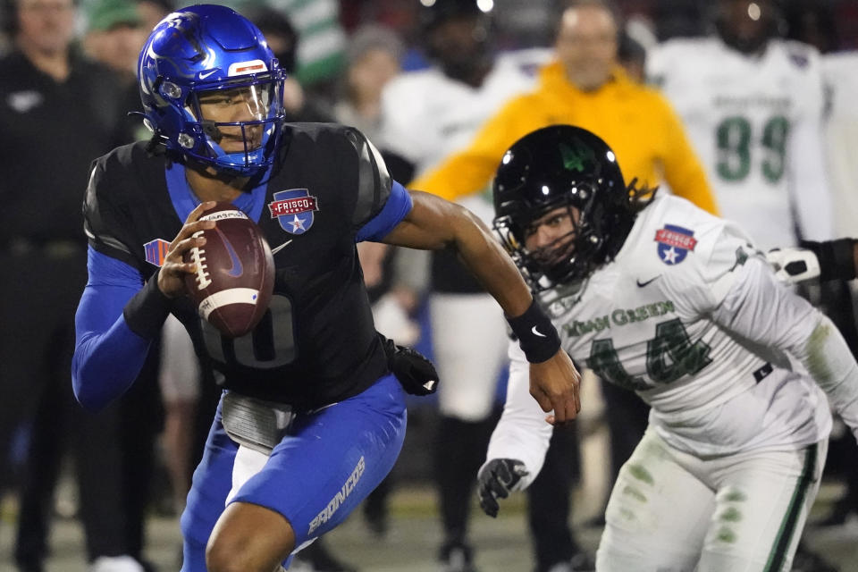 FILE - Boise State quarterback Taylen Green (10) runs from North Texas linebacker Mazin Richards (44) during the first quarter of the Frisco Bowl NCAA college football game, Dec. 17, 2022, in Frisco, Texas. It’s been four years since Boise State last claimed a Mountain West championship. That might not seem like much of a drought, but for the Broncos it’s been a frustrating stretch of missed chances at the conference crown. (AP Photo/LM Otero, File)