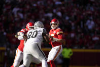 Kansas City Chiefs quarterback Patrick Mahomes drops back to pass during the first half of an NFL football game against the Las Vegas Raiders Sunday, Dec. 12, 2021, in Kansas City, Mo. (AP Photo/Charlie Riedel)
