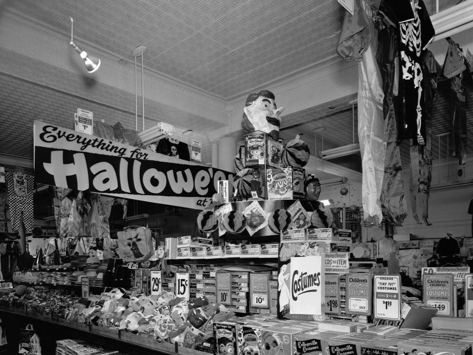 Ready-to-wear boxed costumes in a Halloween surplus store in 1950