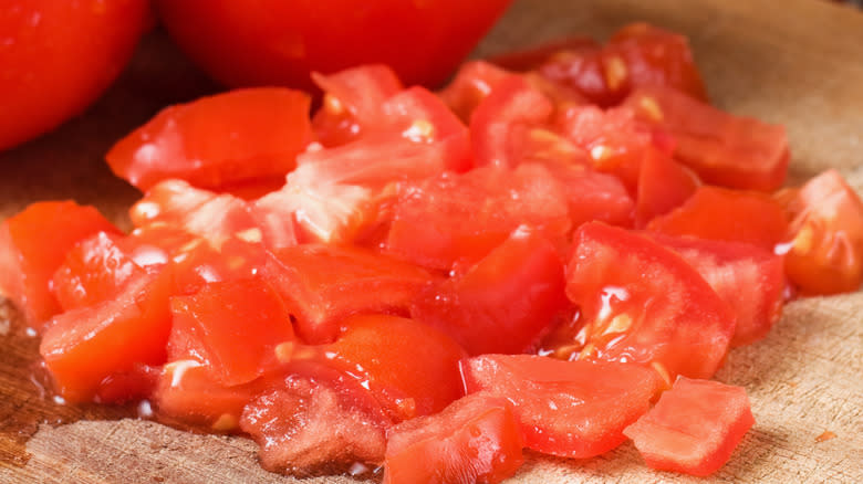 Tomatoes chopped on a cutting board