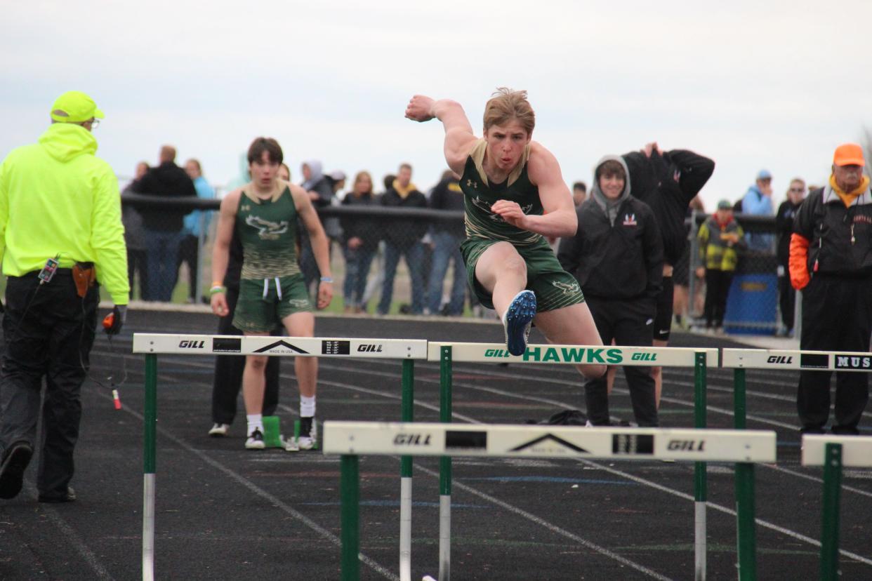 A Woodward-Granger runner competes during the West Central Activities Conference Meet on Tuesday, May 3 in Woodward.