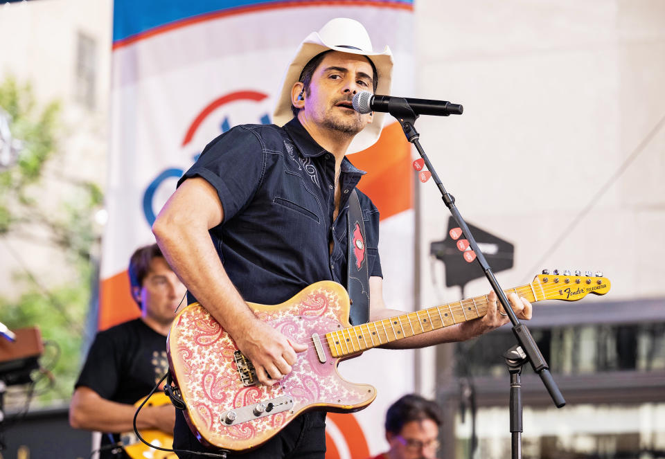 Following a morning storm that soaked the plaza, Brad Paisley opened the show with a performance of his 2009 song 